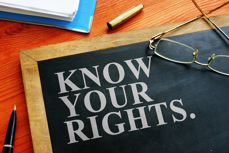 Blackboard on a table with words "Know your rights."