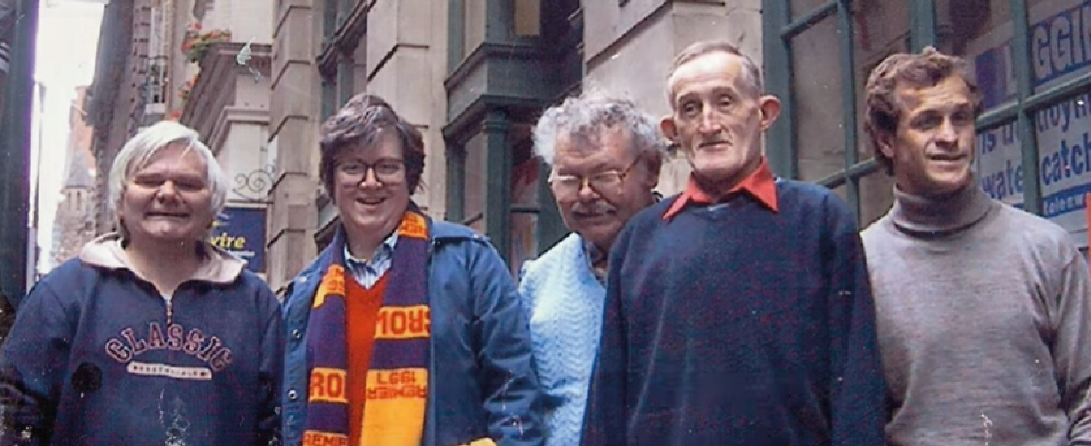 Image is of Reinforce members standing on the street.