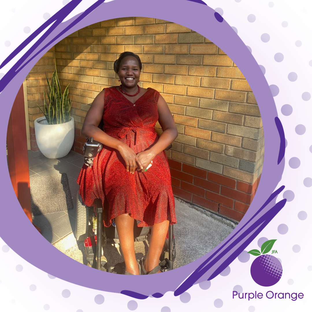 gradient background with dots. Grey purple misshapen circle with dark purple lines borders a photo of Esther, a feminine presenting person of colour wearing a red dress, siting in a motorised wheelchair.