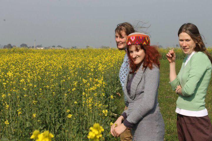 Ellen in a field with two other travellers.jpg