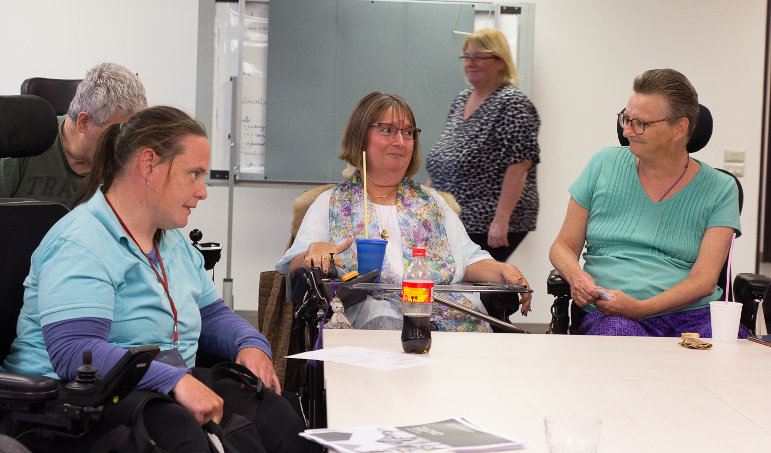 Photo is of the Disability Elders of All Ages discussing straws